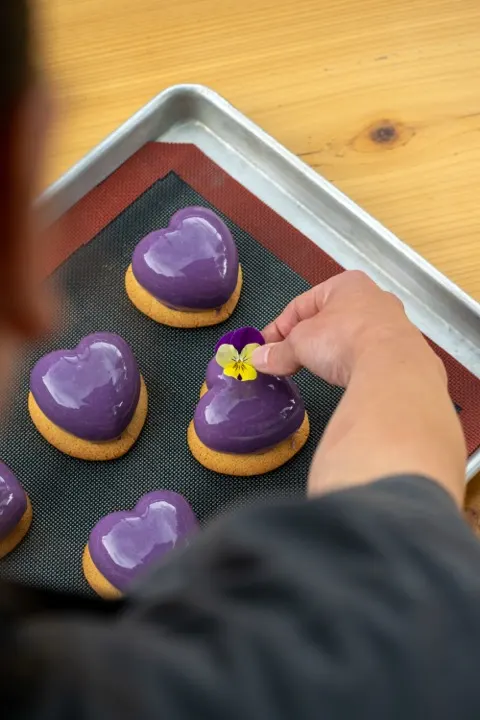 Heart-shaped entremets with edible pansies
